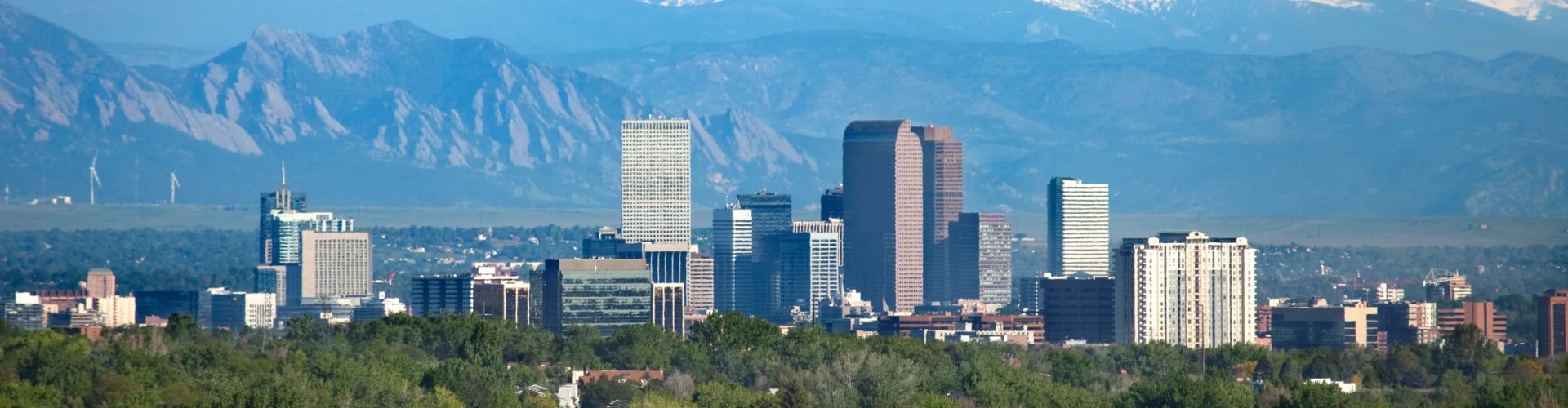 Evening riverside shot of Denver skyline