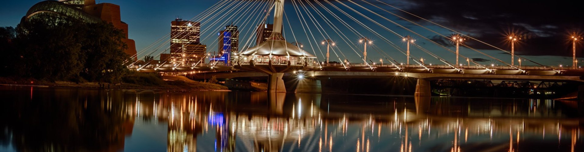 Evening riverside view of Winnipeg, MB, CA