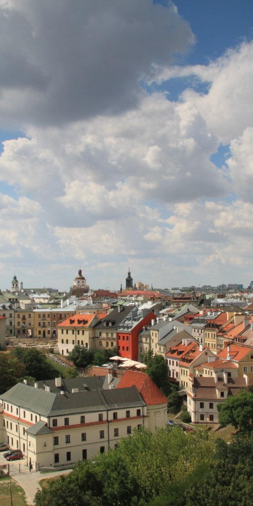 Street scene in Lublin with trams and pedestrians