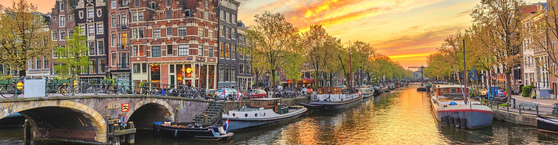 Evening riverside view of Amsterdam, NL